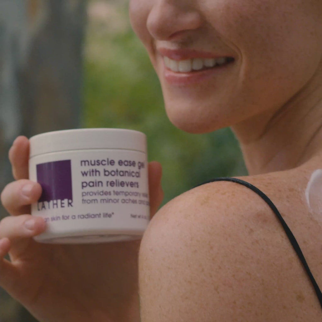 Woman applying muscle ease gel to her shoulder.